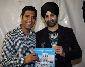 Gurvinder Sandher presenting copy of Coming to Gravesham to Sukshinder Shinda