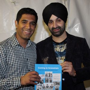 Gurvinder Sandher presenting copy of Coming to Gravesham to Sukshinder Shinda
