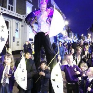 Pupils from Our Lady Hartley School with Will the Stilt Walker